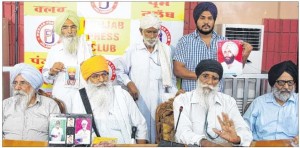 Advocate Amar Singh Chahal (sitting - right corner) and Journalist Dalbir Singh (sitting - left corner) with family members of victims of Fake encounters in Punjab. (Jalandhar - 14 July, 2013)
