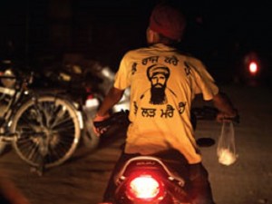 A young Sikh wearing T-shirt with Image of Sant Bhindranwale
