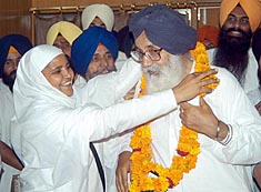 File Photo: Former SGPC chief Bibi Jagir Kaur garlanding Parkash Singh Badal after he was re-elected as the President of the Shiromani Akali Dal in Amritsar on 13 June, 2004