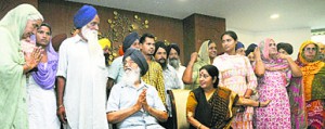 Family members of 28 out of 40 Punjabis workers abducted in Iraq meet Sushma Swaraj. They were accompanied by Punjab CM Parkash Singh Badal. [File Photo]