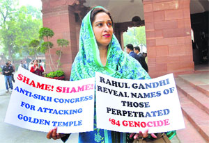 MP Harsimrat Kaur Badal with placards during a protest in New Delhi on Feb. 06
