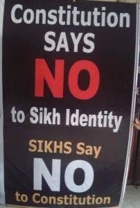A hoarding displayed during protest demonstration at Amritsar on January 24, 2014