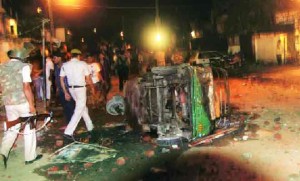 Several vehicles including police vans torched in Tilak Vihar on August 15, 2013
