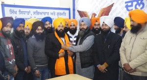 Activists of Sikh Youth of Punjab presenting siropa to Noblejit Singh after his nomination