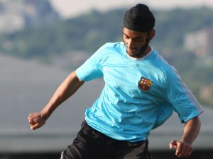 Dilpreet Singh plays in a pick-up soccer game in Montreal. The Quebec Soccer Federation has lifted its ban on the wearing of turbans in organized games.