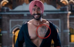 Ajay Devgan in and as "Son of Sardar" (Hindu god Shiva's tattoo on his chest has also attracted controversy)